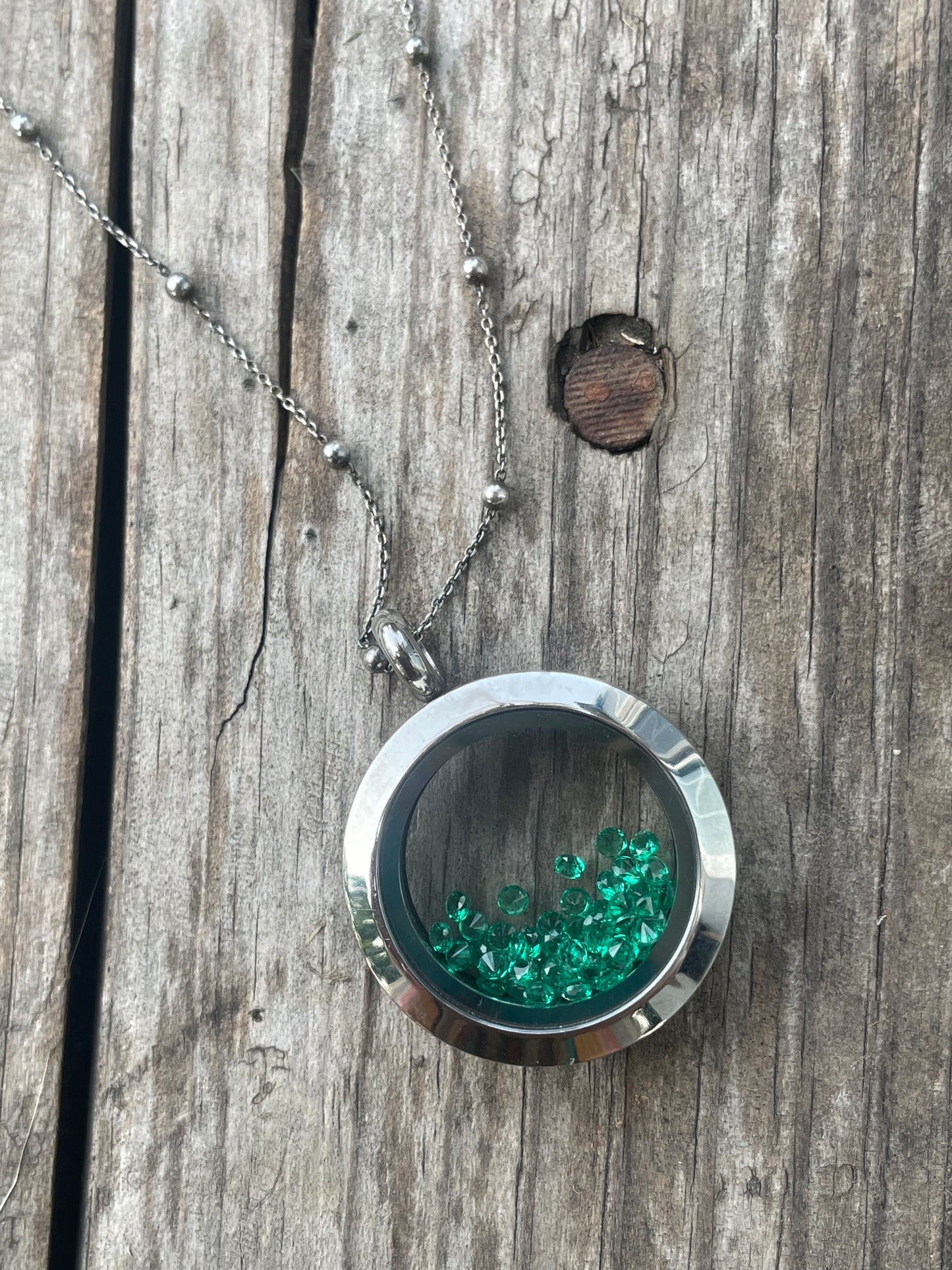 Loose green gemstone locket necklace